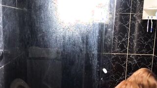 Young man eating his friend's aunt inside the restroom of