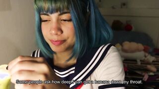 Deep throat: schoolgirl slips a whole banana inside her mouth.