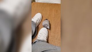 Rubbing his penis with white shoes