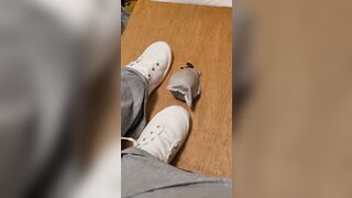 Rubbing his penis with white shoes