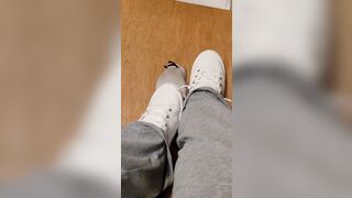 Rubbing his penis with white shoes