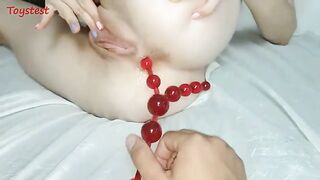 She took off the anal beads and inserted them VERY