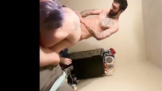 Tattooed lovers having a trio