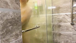 A young pervert looked at his stepmother inside the shower