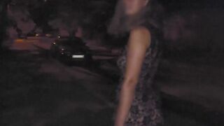 chick walking into a transparent lace dress at night