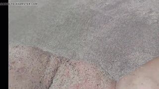 Marineide Ramos dig herself on the beach.