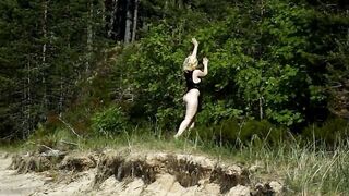 By the beach inside a nylon bodysuit I twist a long ass