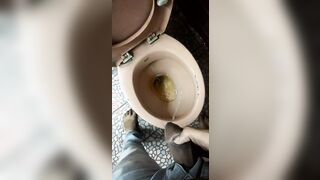 Indian boy pissing in toilet