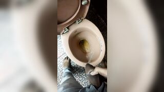 Indian boy pissing in toilet