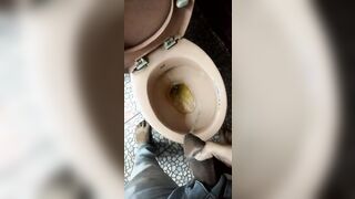 Indian boy pissing in toilet