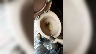 Indian boy pissing in toilet