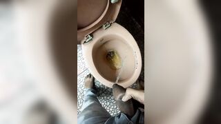 Indian boy pissing in toilet