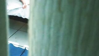 watching my sister into law masturbating and into a g-string through the door