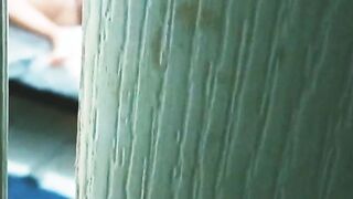 watching my sister into law masturbating and into a g-string through the door