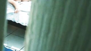 watching my sister into law masturbating and into a g-string through the door