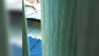 watching my sister into law masturbating and into a g-string through the door