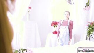 Curvy photographer rimmed by a florist