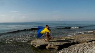 Dancing on Mediterranian Sea Beach with Yellow-Blue Shawl