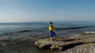 Dancing on Mediterranian Sea Beach with Yellow-Blue Shawl