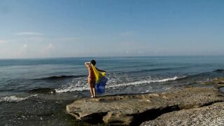 Dancing on Mediterranian Sea Beach with Yellow-Blue Shawl