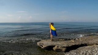 Dancing on Mediterranian Sea Beach with Yellow-Blue Shawl