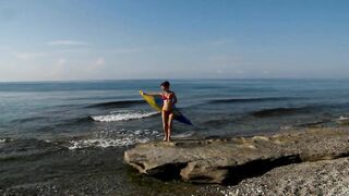 Dancing on Mediterranian Sea Beach with Yellow-Blue Shawl
