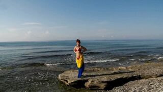 Dancing on Mediterranian Sea Beach with Yellow-Blue Shawl