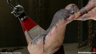 Hogtied sub suspended and candle waxed