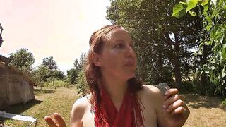 Topless Dark Haired Picking Cherries from the Tree