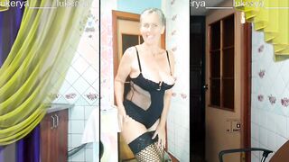 Seductive middle-aged Lukerya warms up with a cheerful smile during the cam broadcast.