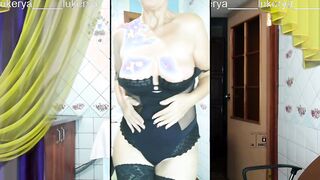 Seductive middle-aged Lukerya warms up with a cheerful smile during the cam broadcast.