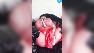 Susi into red fishnet She is wearing ebony boots rubbing cunt