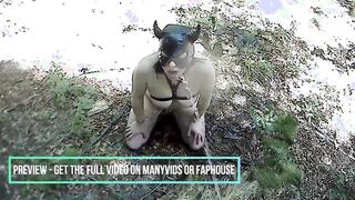 A nude submissive bimbo crouches inside the woods while he pisses on her face