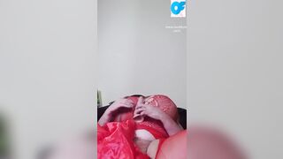 View nasty Susi lying on back having fun with vibrator between boobs
