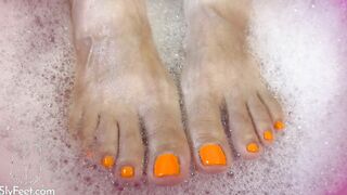 Feet plowed and devils pedicure while toes are inside the toes wash basin