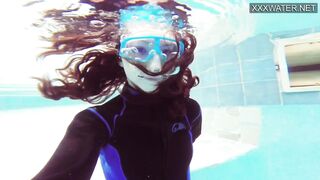 Emi Serene grind her vagina and films it into the swimming pool