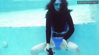 Emi Serene grind her vagina and films it into the swimming pool