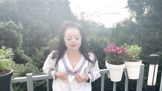 Cutie Gf Lara is touching her boobs outdoors