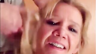 Blonde granny is taking a cumshot on her eyes