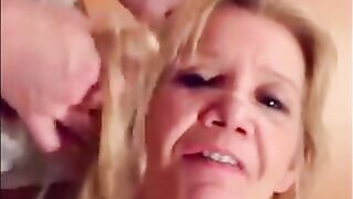 Blonde granny is taking a cumshot on her eyes