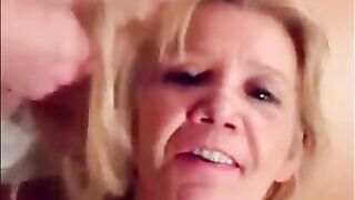 Blonde granny is taking a cumshot on her eyes