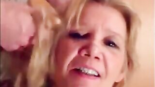 Blonde granny is taking a cumshot on her eyes