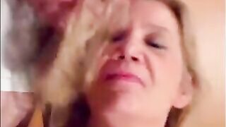Blonde granny is taking a cumshot on her eyes