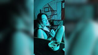 Bombshell stepsister smokes a cigarette