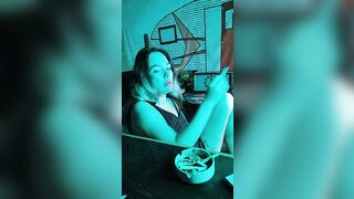 Bombshell stepsister smokes a cigarette