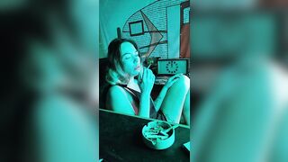 Bombshell stepsister smokes a cigarette