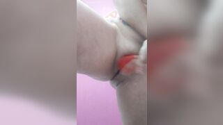 smearing moisturizing milk on her melons and booty