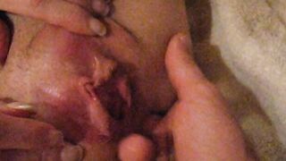 Fingers her butt while she plays with her clitoris!