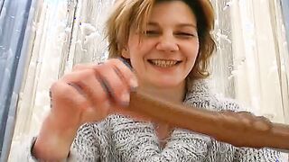 Short haired German skank spreading her unshaved cunt lips on her bed