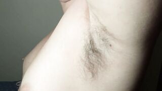 Ellie shows her bushy armpits and plays with them